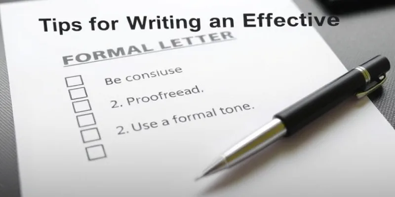 Checklist of tips for writing a formal letter next to a pen.