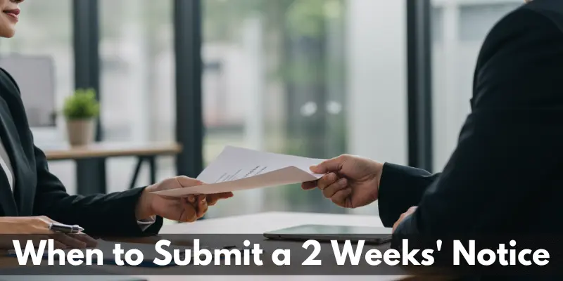 submit notice letter Employee handing a resignation letter to their manager.